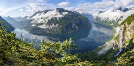 Panorama over the Geirangerfjord, Gjerdefossen waterfall, at Ørnesvingen viewpoint, atmospheric