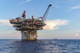 Private fishing boats near offshore petroleum drilling rig in the Gulf of Mexico