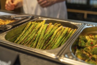Asparagus and broccoli on a tray in a buffet setting in the kitchen, event and wedding location