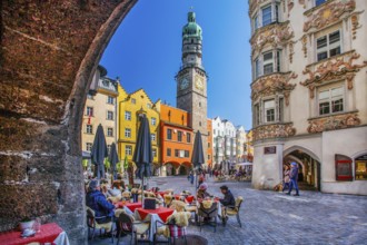 Street café on Herzog-Friedrich-Strasse with the Helblinghaus and city tower in the old town,