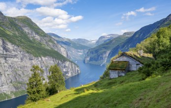 Blomberg Gård, historic mountain farm with grass roof on a steep mountainside above the