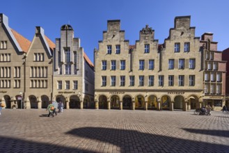 Old town, historical buildings, facade, window, gable, arcades, cobblestone street, pedestrians as
