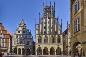 Historic town hall, facade, windows, arcades, gable, cobblestone street, pedestrians as secondary