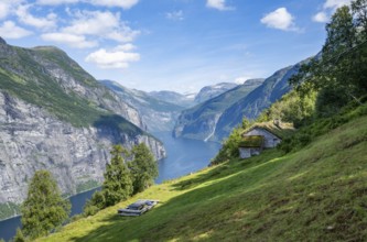 Blomberg Gård, historic mountain farm with grass roof on a steep mountainside above the