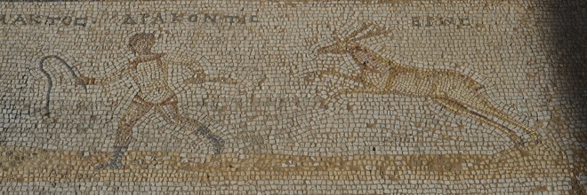 Ancient mosaic with a hunting scene of a man and a gazelle, Archaeological Site, Western