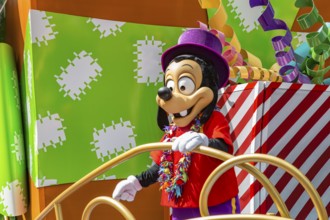 Disney character riding on float during parade through the Frontierland area of Magic Kingdom at