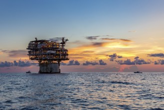 Private fishing boats near offshore petroleum drilling rig in the Gulf of Mexico