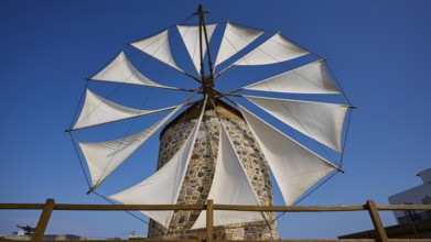 Large sails of a windmill over a wooden fence, Windmill, Antimacheia, Kos, Dodecanese, Greek