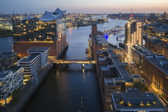 Aerial view of the Elbphilharmonie at blue hour with harbour and Elbe in the background, Hamburg,