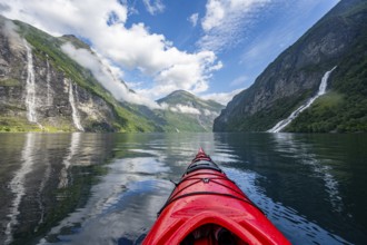 Kayak trip on the Geirangerfjord with waterfall The Seven Sisters and Freier Waterfall, tip of a