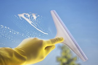 Glass cleaning: Close-up of a window pane being cleaned