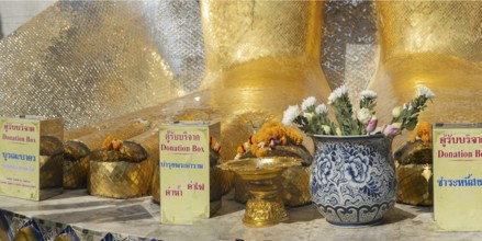 Feet of a 32 metre high standing Buddha decorated with glass mosaics and 24 carat gold, Luang Pho