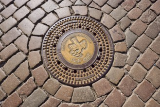 Manhole cover, 350 years of the Peace of Westphalia, 1648 to 1998, golden, cobblestones, biblical