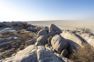 Round rocks of Kubu Island with view over the salt pan, Kubu Island (Lekubu), Sowa Pan,