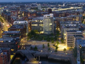 Aerial view of the Speicherstadt Hamburg with Magellan Terraces at Sandtor harbour at blue hour,