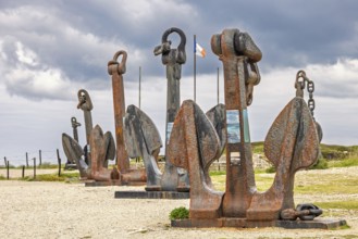 Old rusty anchor from warships by the Atlantic Battle Memorial Museum at Pointe de Pen Hir,