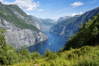 View of the idyllic fjord landscape of the Geirangerfjord at Blomberg Gård, near Geiranger, Møre og