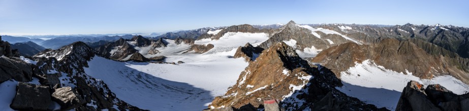 Mountain panorama at Wilder Freiger summit, picturesque high mountain landscape with snow, view of