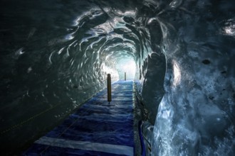 Artificial ice cave through the glacier ice, Mer de Glace, Montenvers, Chamonix, Haute-Savoie,