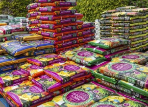 Multi Purpose compost bags stacked up at Lowden garden centre, Wiltshire, England, UK