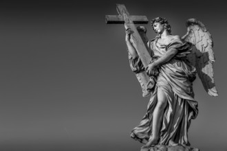 Rome, statue of an angel on the bridge in front of Castel SantAngelo. Conceptual useful for