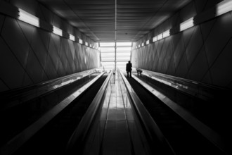 A train passenger exits a subway station in Seoul, Republic of Korea