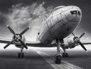 historical airplane on a runway is waiting for take off