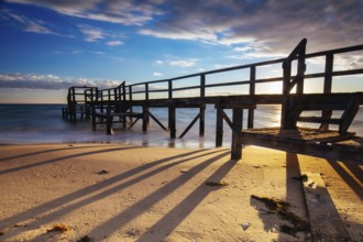 Piers near Millionaire's Walk at Point King Beach on a cool winter's morning at sunrise on the