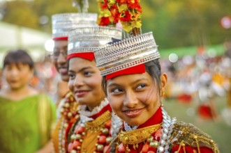 Shillong, Meghalaya, circa April 2012: Smiling girls in traditional costumes with large beads and