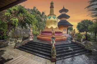 A Buddhist temple in the evening in the rain. The Brahmavihara Arama Temple has beautiful gardens