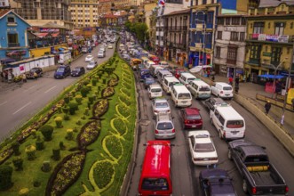 View from a bridge showing a street full of cars stuck in a traffic jam on the city highway in rush