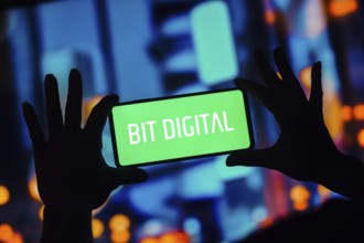 In this photo illustration, the Bit Digital logo is displayed on a smartphone screen