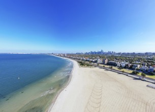 View towards Melbourne skyline on a warm summer's morning from St Kilda West Beach in Australia