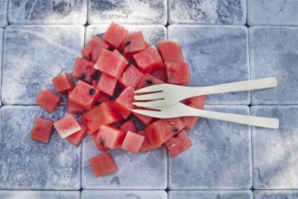 Presentation of a summer dish made of diced watermelon