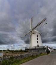 Blennerville, Ireland, 5 August, 2022: view of the historic Blennerville Windmill in Tralee Bay in