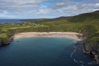 A drone aerial view of the beautiful Silver Strand and horseshoe bay at Malin Beg on the Wild