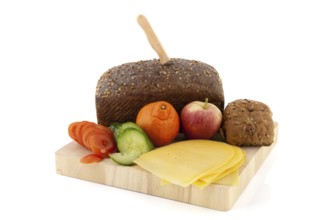 Making healthy brown bread with cheese fruit and vegetables