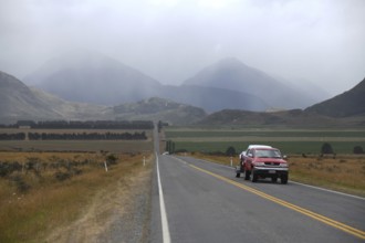 Traffic heading for Christchurch on SH73 leaves behind the rain on the West Coast