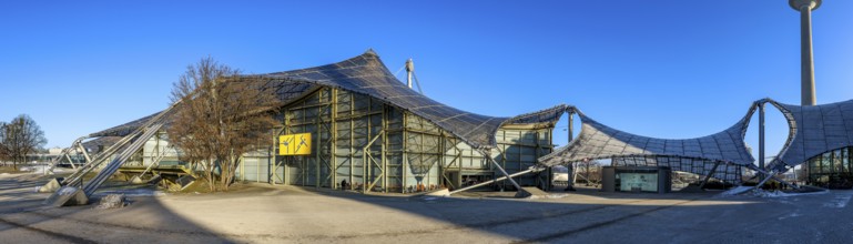 Panoramic photo of the Olympic site with the Olympic buildings in front of a blue sky, Munich,