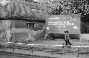 08.10.1981 GDR East Berlin district of Prenzlauer Berg. Agitation poster on a damaged house in