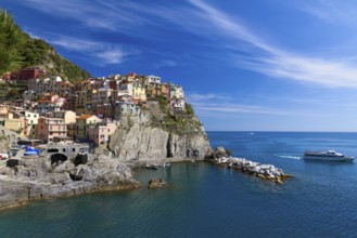 Village of Manarola with ferry, Cinque Terre, Italy, Europe
