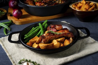 Pork with beans and quarter potatoes