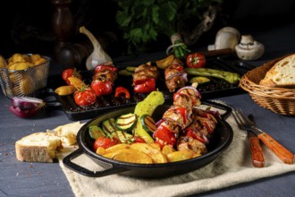 Shish kebab with various vegetables and spices Country potatoes