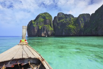 Boat trip on the native boat. Sea water is emerald green and the islands covered with green plants.