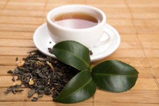 A cup of green tea with freh leaves, lodz, poland