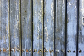 Weathered wooden boards screwed together in detail as background