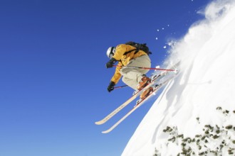 Skiers in action, skiing down the slope