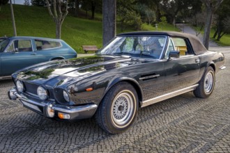 Lisbon, Portugal, Jan 20, 2024: Classic brown Aston Martin V8 Volante grand tourer parked on a