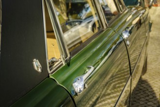 Lisbon, Portugal, Jan 20, 2024: Details of side view of classic green Rover P6 Series II or Mark II