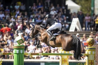 Daniel Coyle of Ireland and riding Legacy compete in the first round of the 1.60m CPKC